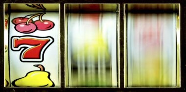 Close-up view of three dice being shaken and revealed by a live dealer in a Sic Bo game
